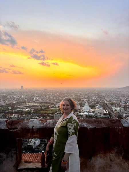 Guest enjoying panoramic sunset views over Jaipur city