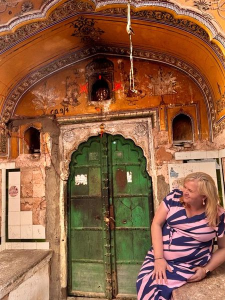 Guest exploring a traditional heritage haveli doorway in Rajasthan