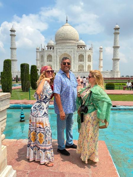 Happy guests with their guide in front of the Taj Mahal, Agra